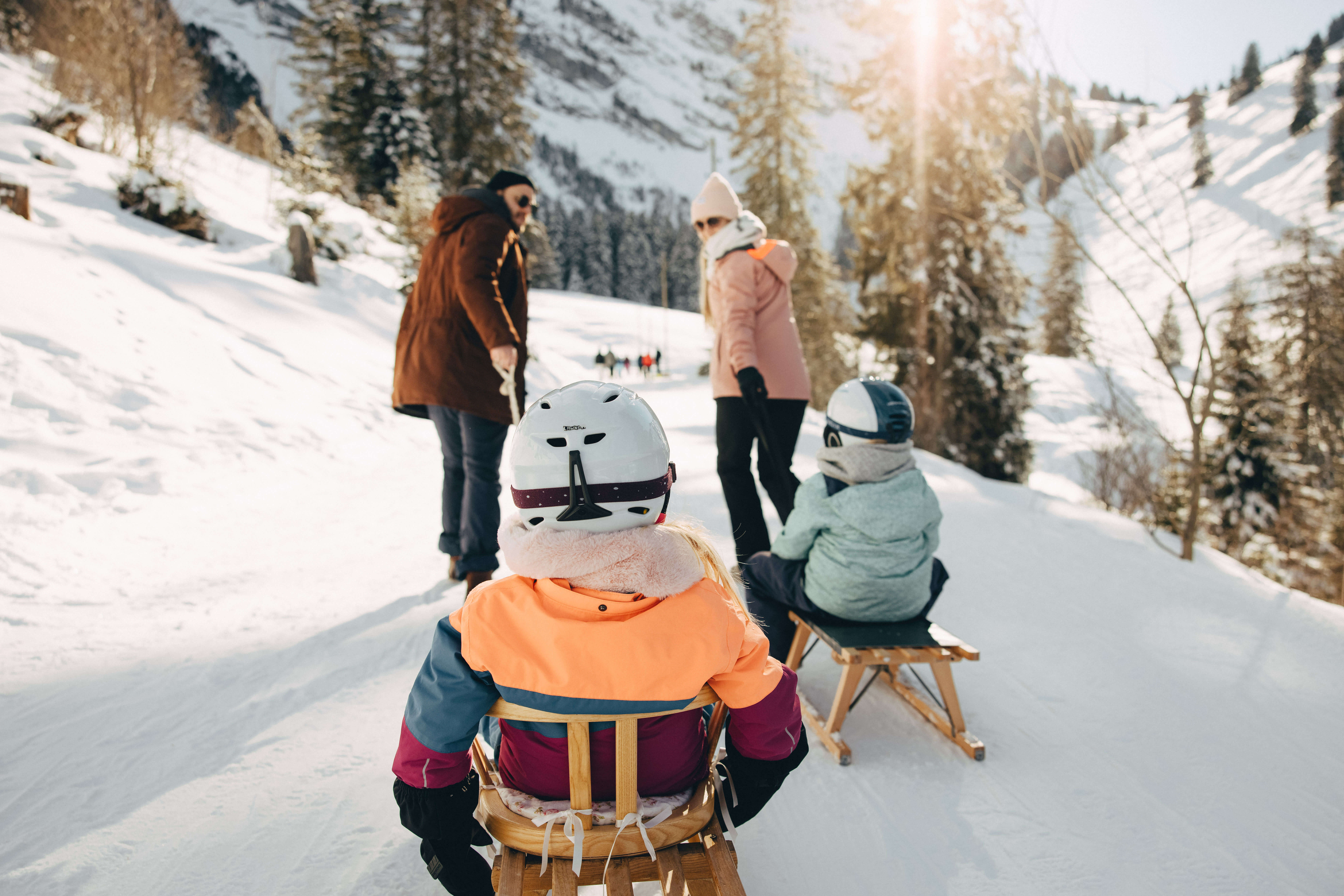 Picture Parents pulling children sitting on the sledge - to the picture