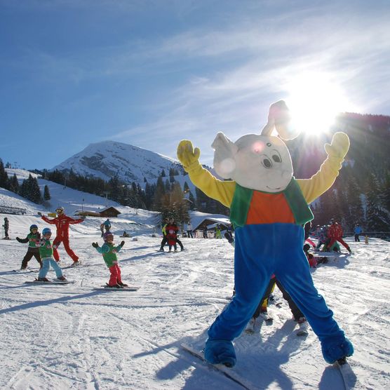 Photo The mascot Snowli on the ski slope - to the photo
