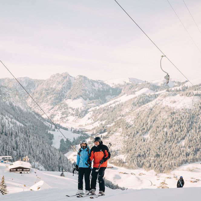 Photo Two skiers on the T-bar lift - to the photo